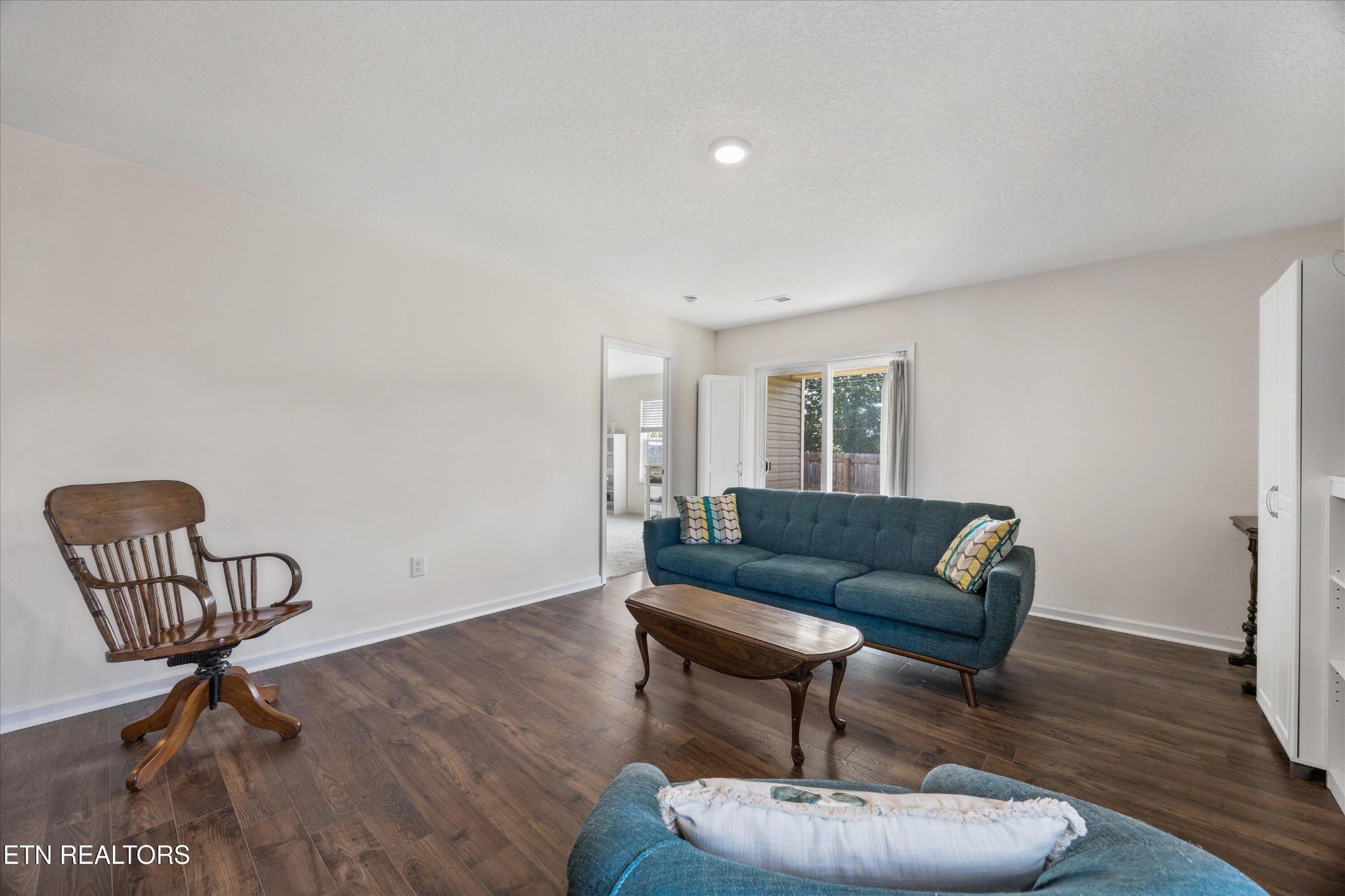 248 Belle Court Talbott, TN 37877 - Photo 16 of 36 a living room with furniture and a wooden floor