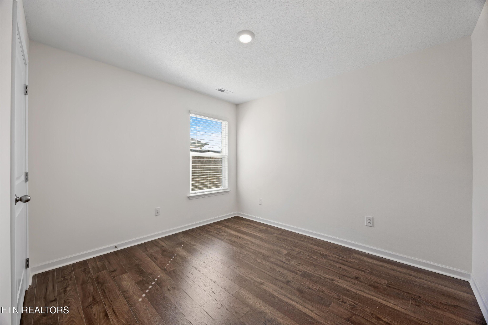 248 Belle Court Talbott, TN 37877 - Photo 21 of 36 a view of room with window and hardwood floor