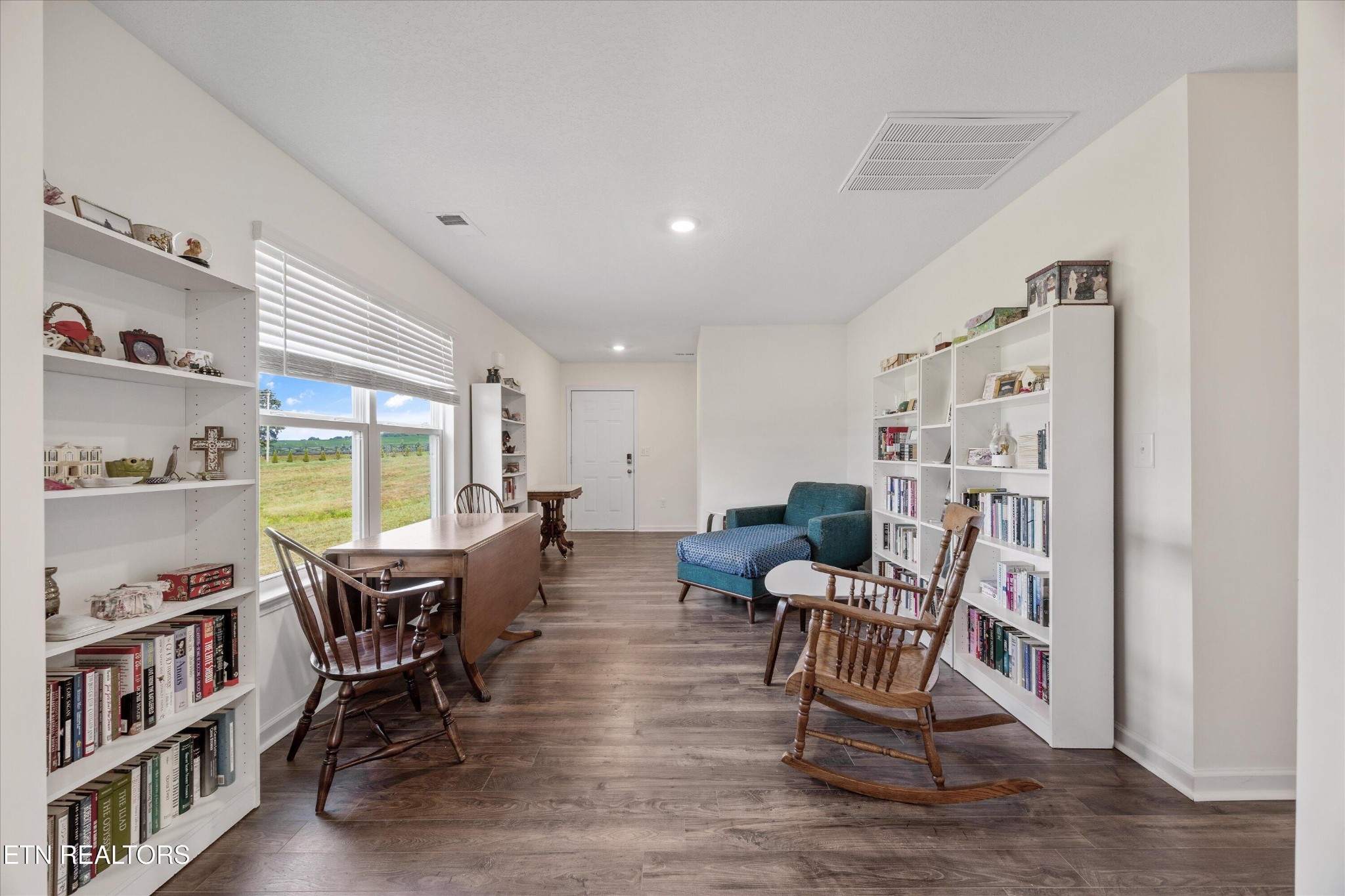 248 Belle Court Talbott, TN 37877 - Photo 7 of 36 a living room with furniture and a book shelf