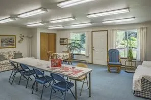a dining room with furniture and window