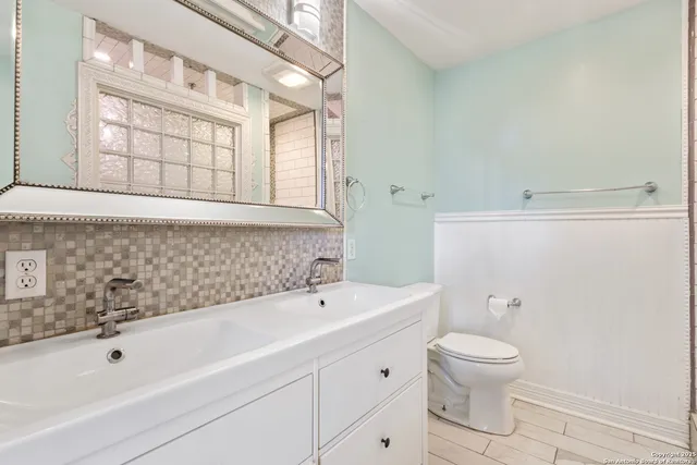 a bathroom with a bathtub and sink
