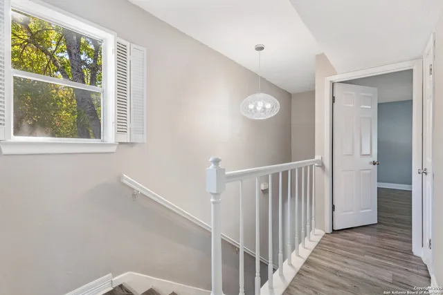 a view of a hallway with windows