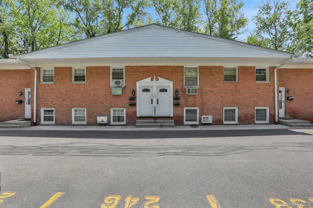 front view of a house with a garden