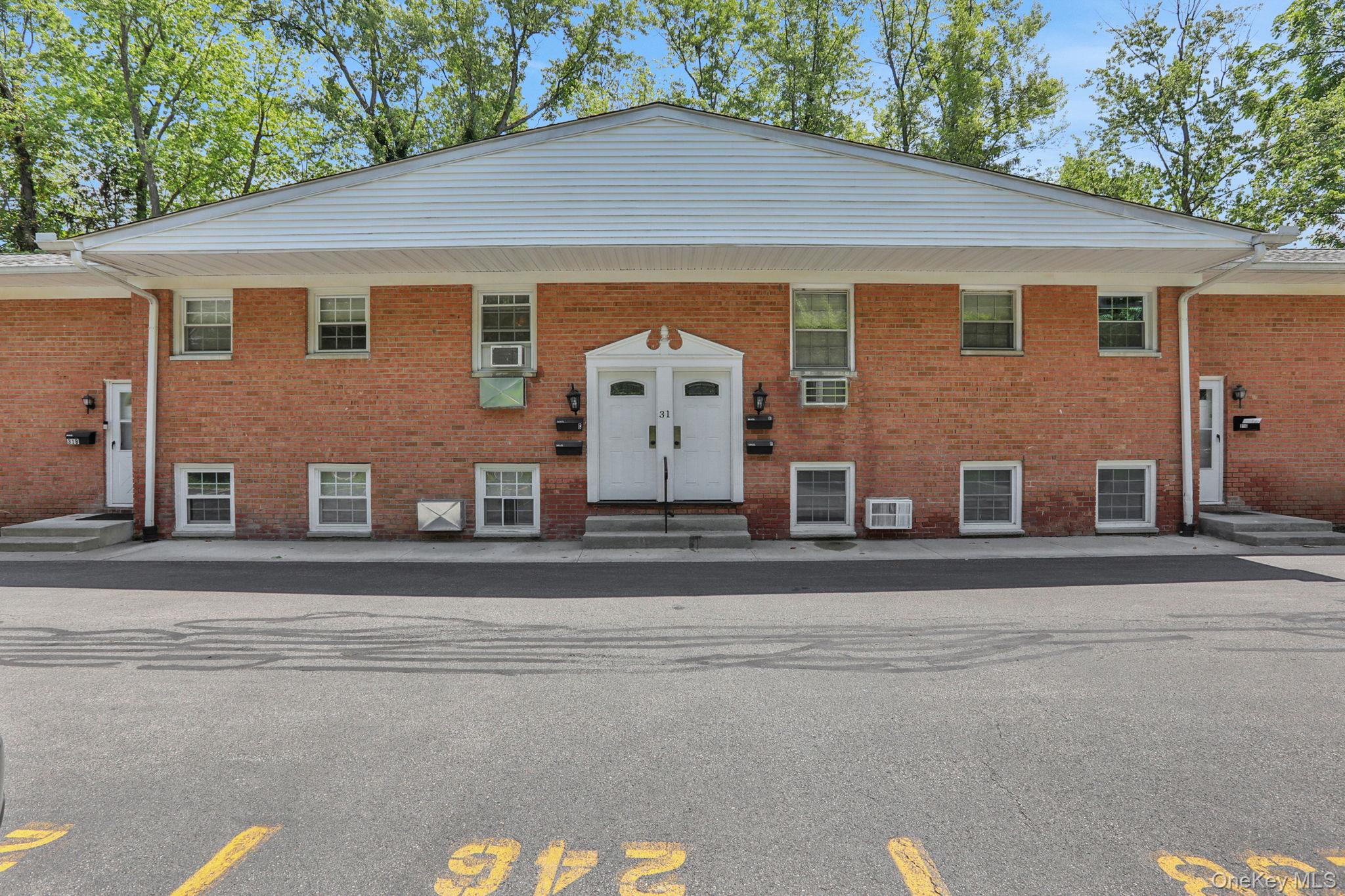 31 C Alpine Drive Wappingers Falls, NY 12590 - Photo 1 of 19 front view of a house with a garden