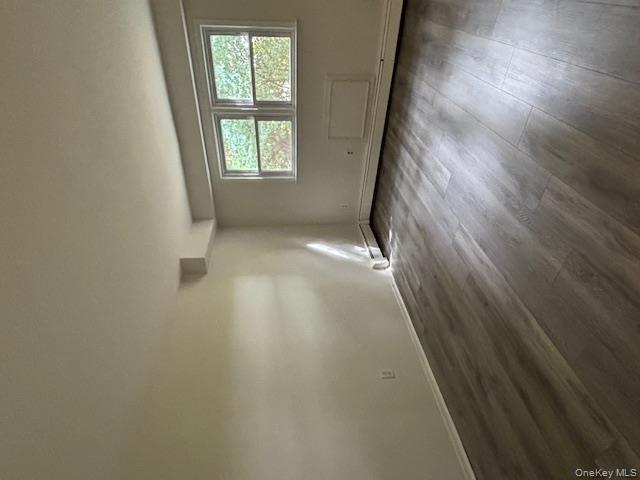 31 C Alpine Drive Wappingers Falls, NY 12590 - Photo 12 of 19 an empty room with wooden floor and windows