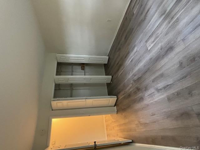 31 C Alpine Drive Wappingers Falls, NY 12590 - Photo 14 of 19 an empty room with wooden floor and windows