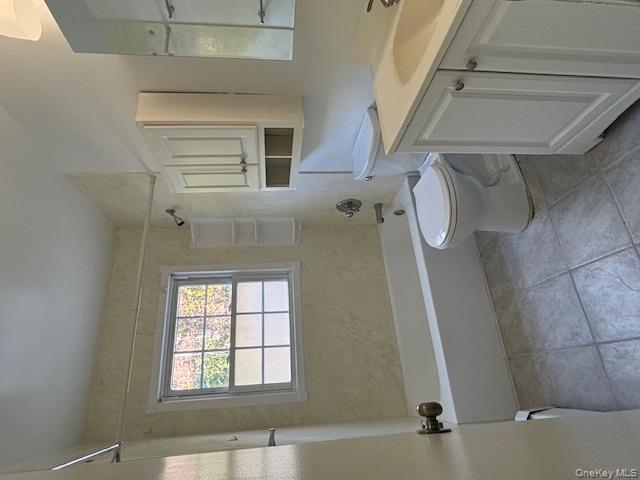 31 C Alpine Drive Wappingers Falls, NY 12590 - Photo 15 of 19 a bathroom with a sink a toilet and shower