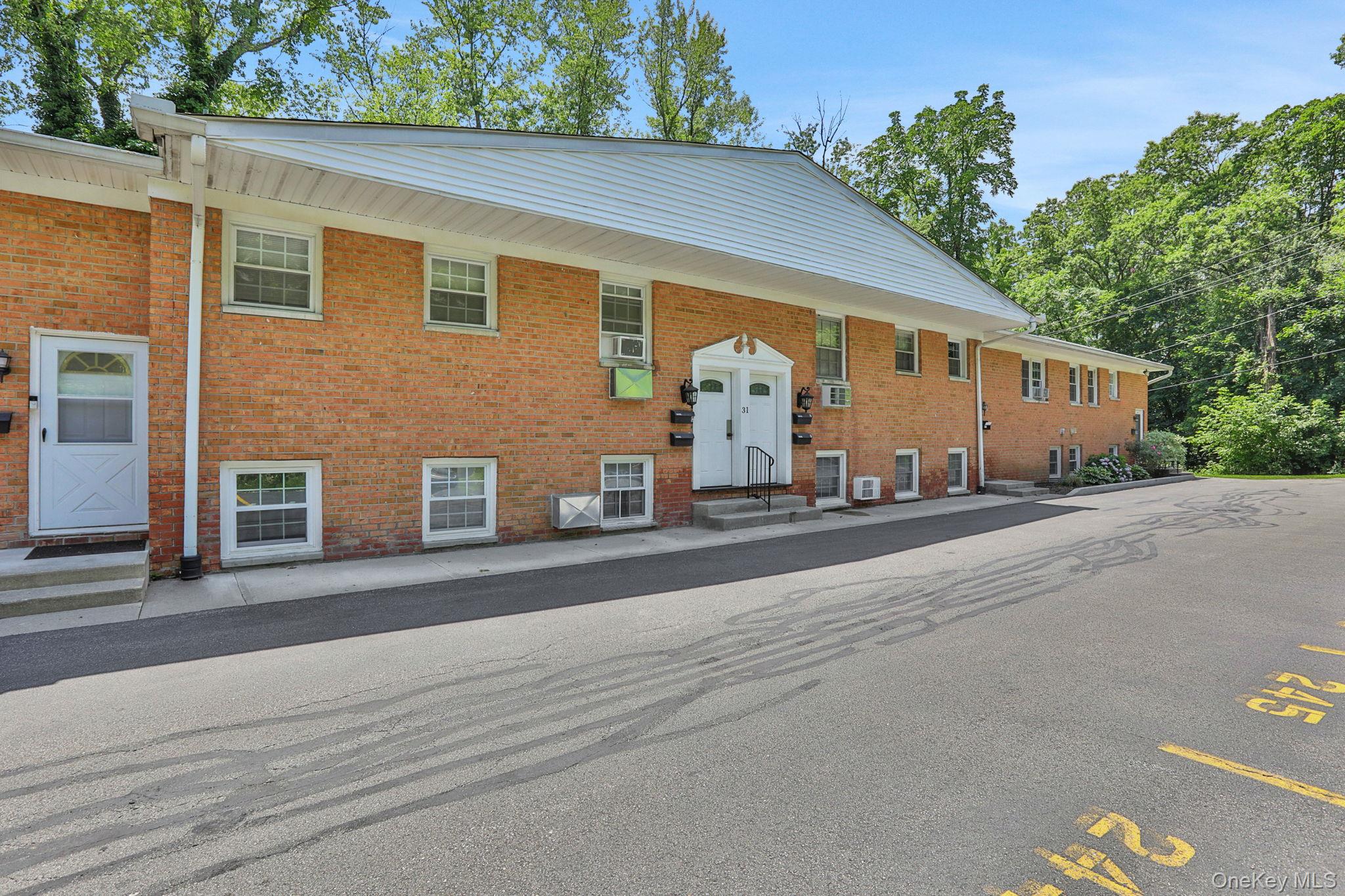 31 C Alpine Drive Wappingers Falls, NY 12590 - Photo 2 of 19 front view of a house with a street