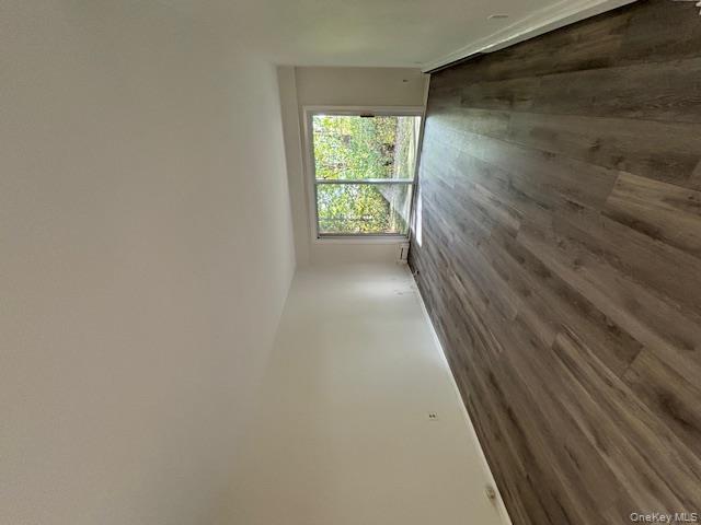 31 C Alpine Drive Wappingers Falls, NY 12590 - Photo 4 of 19 a view of empty room with wooden floor and fan