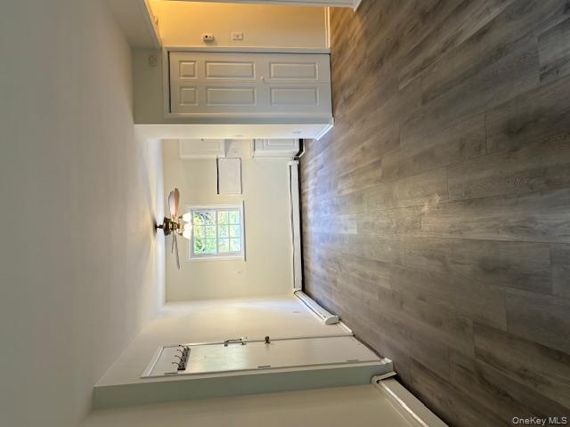 31 C Alpine Drive Wappingers Falls, NY 12590 - Photo 5 of 19 an empty room with wooden floor closet and windows