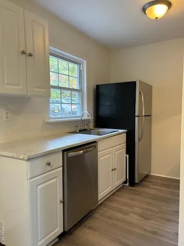 a kitchen with a microwave and a sink