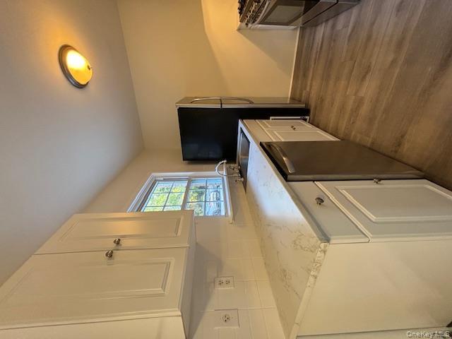 31 C Alpine Drive Wappingers Falls, NY 12590 - Photo 8 of 19 a kitchen with stainless steel appliances a stove a sink and a microwave