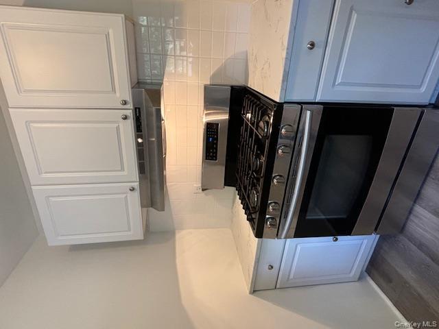 31 C Alpine Drive Wappingers Falls, NY 12590 - Photo 9 of 19 a stove top oven sitting inside of a kitchen