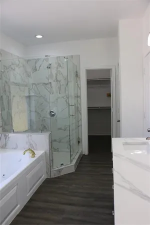 a bathroom with a bathtub and a sink