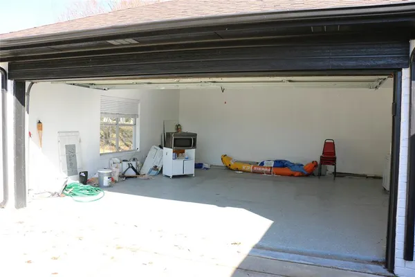 a view of a garage with clothes and shoes