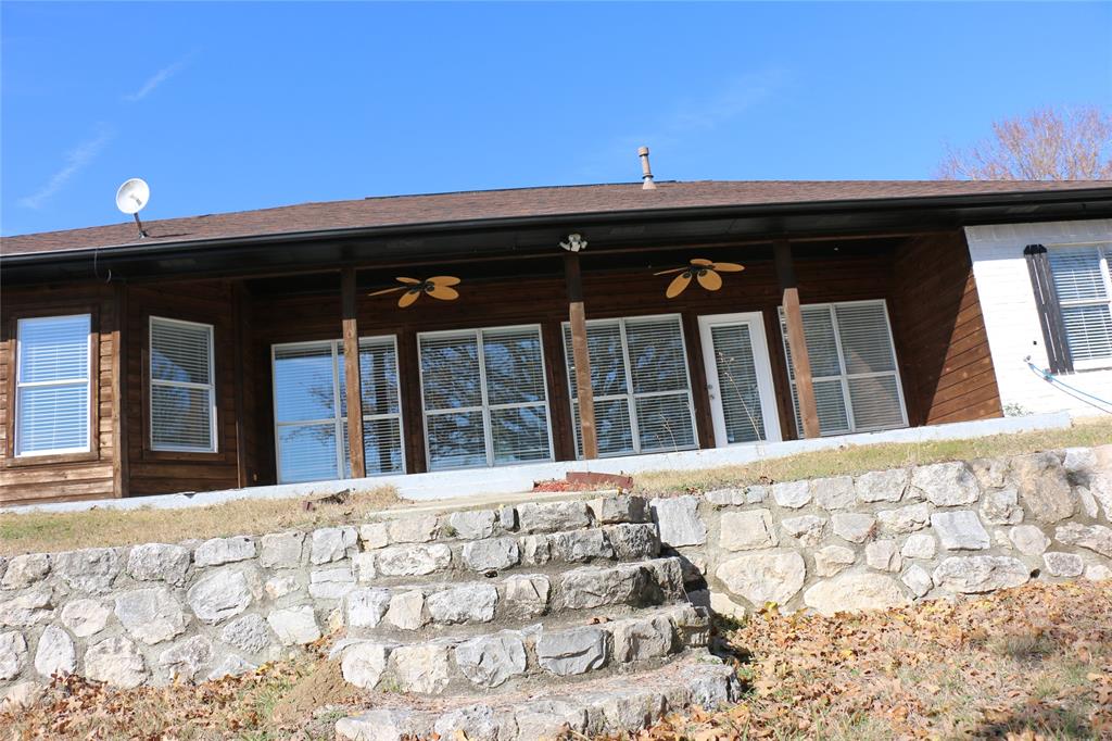 2858 Waters Edge Quinlan, TX 75474 - Photo 27 of 34 a view of a house with a large window