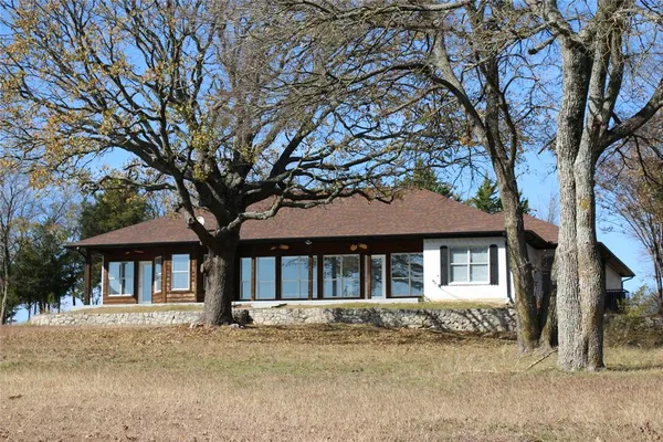 a view of a yard with trees