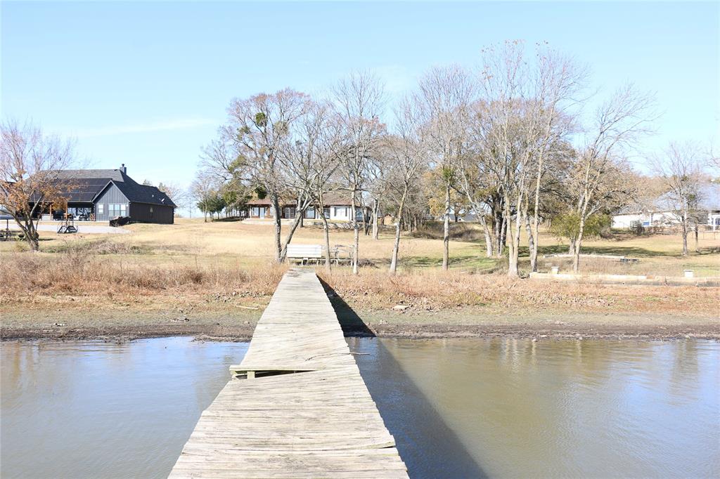 2858 Waters Edge Quinlan, TX 75474 - Photo 31 of 34 a view of a yard with trees