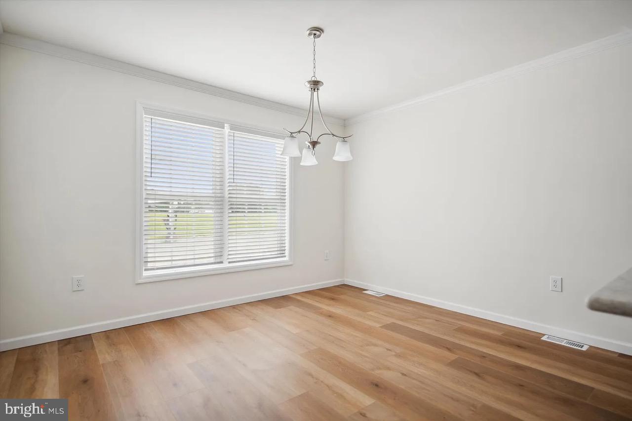 10 Ginger Lane Conowingo, MD 21918 - Photo 19 of 34 an empty room with wooden floor and windows