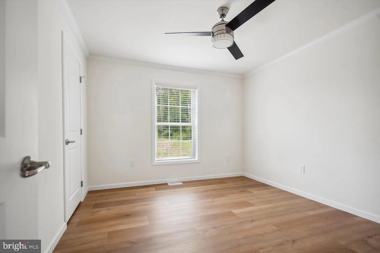 10 Ginger Lane Conowingo, MD 21918 - Photo 23 of 34 an empty room with a empty space and windows