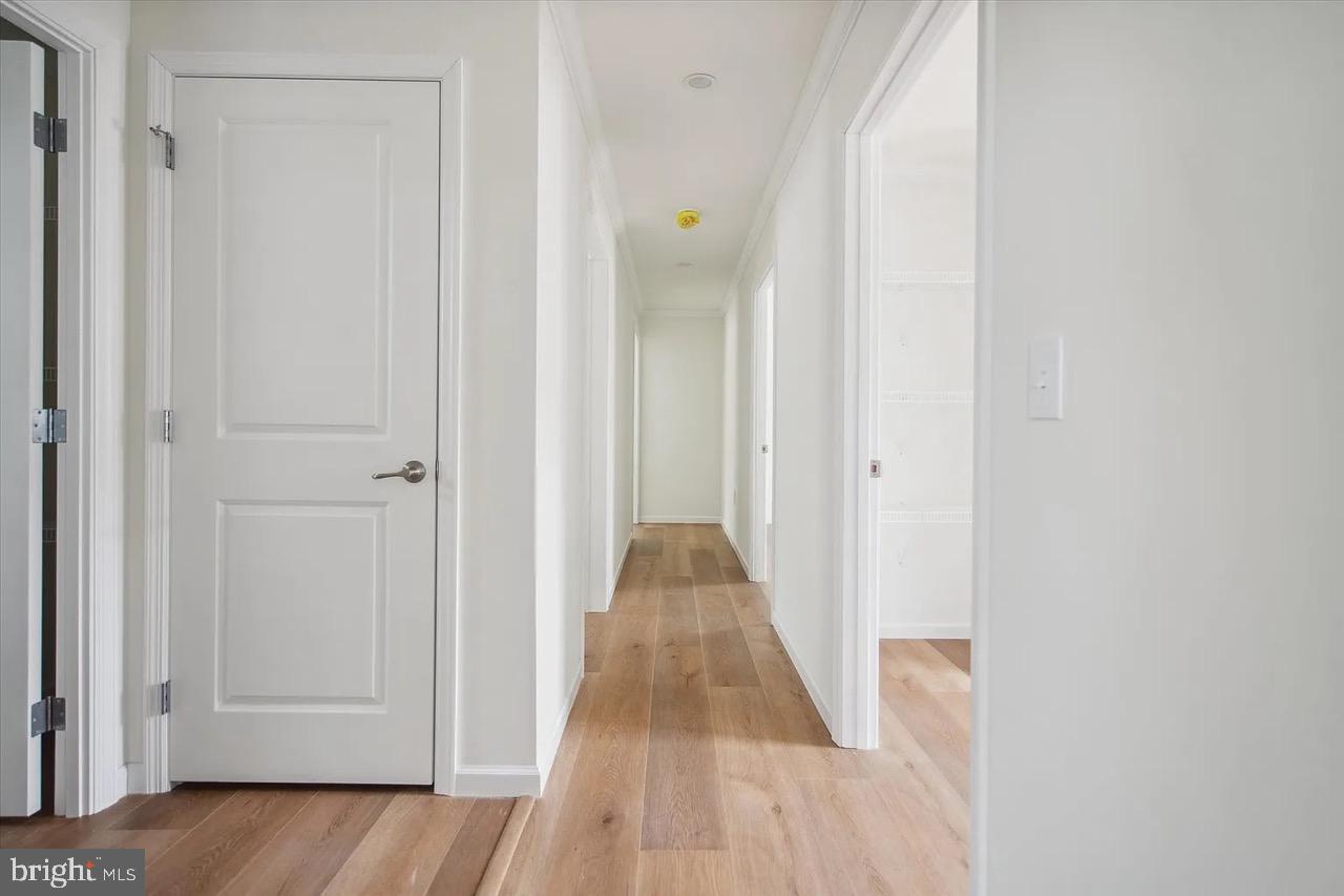 10 Ginger Lane Conowingo, MD 21918 - Photo 25 of 34 a view of a hallway with wooden floor and closet