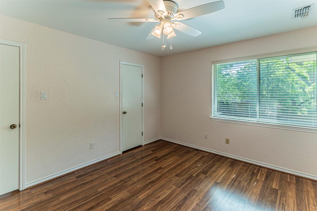 127 Nicklaus Nook Lancaster, TX 75146 - Photo 23 of 37 Unfurnished bedroom with dark wood-type flooring and a ceiling fan