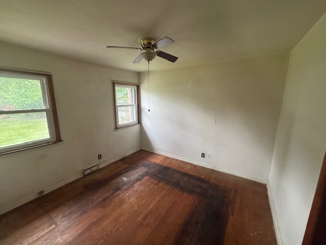 215 North Ohio Street Aurora, IL 60505 - Photo 6 of 8 a view of an empty room with a window