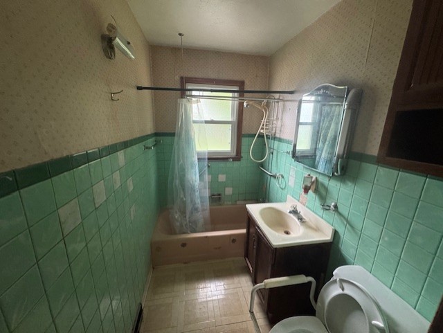 215 North Ohio Street Aurora, IL 60505 - Photo 8 of 8 a bathroom with a sink toilet and shower