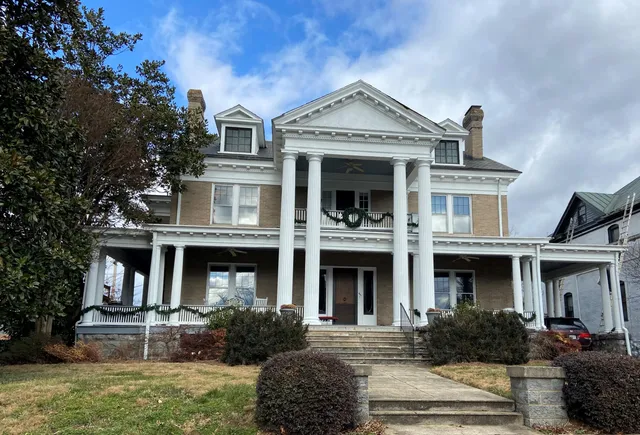 a front view of a house with garden