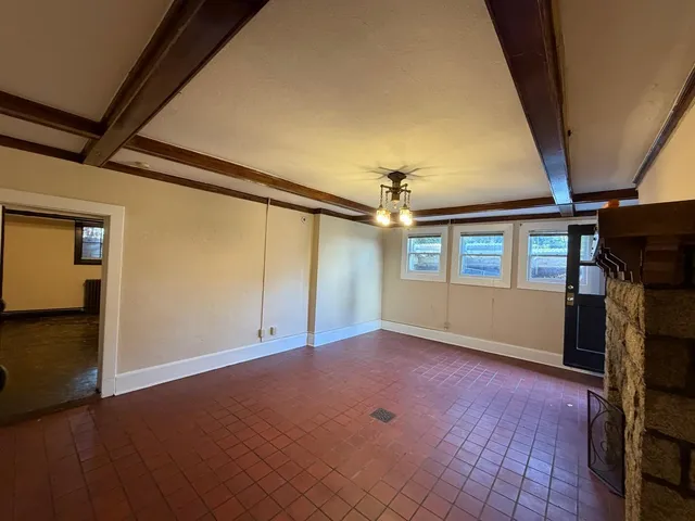a view of a kitchen with a sink and refrigerator