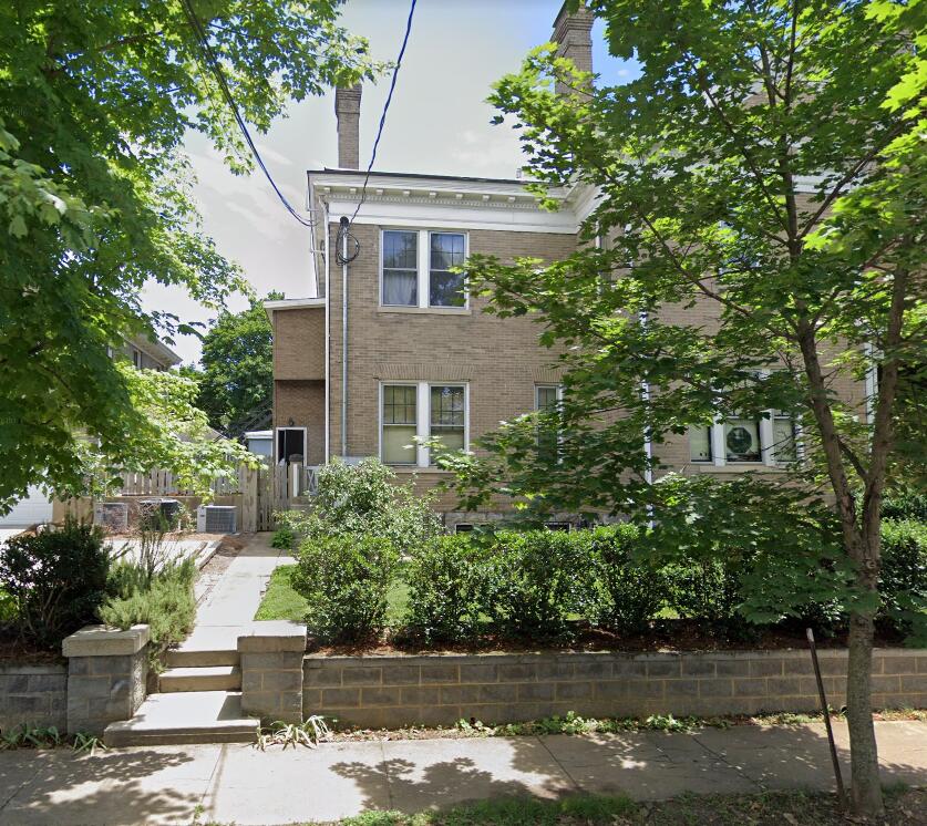441 Highland Avenue Southwest, Unit C Roanoke, VA 24016 - Photo 2 of 14 a front view of a house with a yard