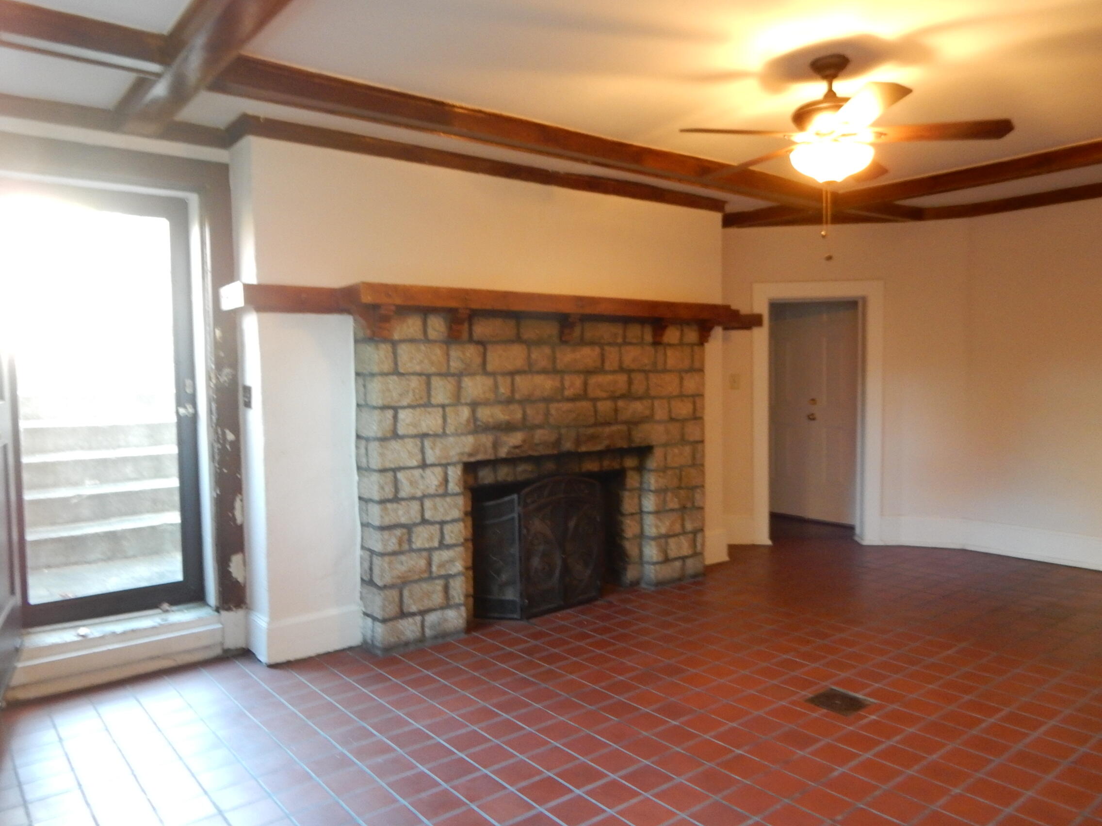 441 Highland Avenue Southwest, Unit C Roanoke, VA 24016 - Photo 6 of 14 a view of empty room with fireplace and wooden floor