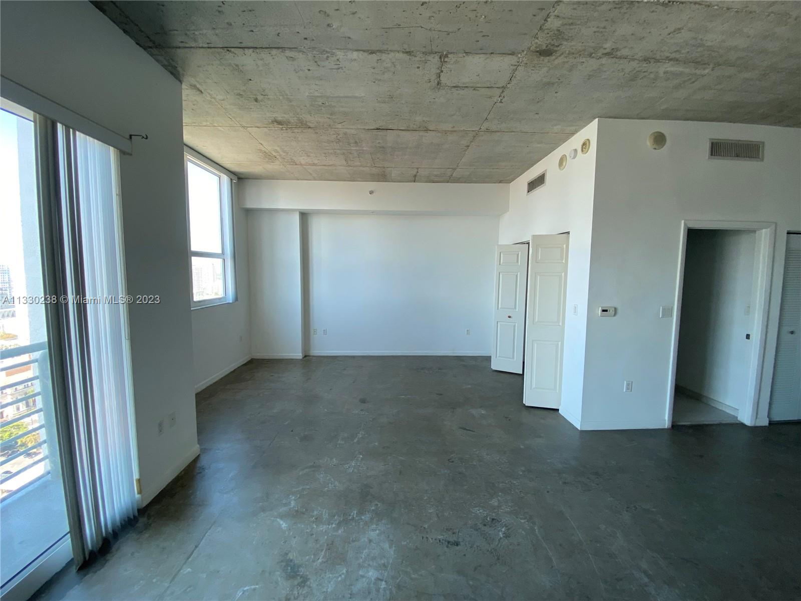 a view of empty room with windows