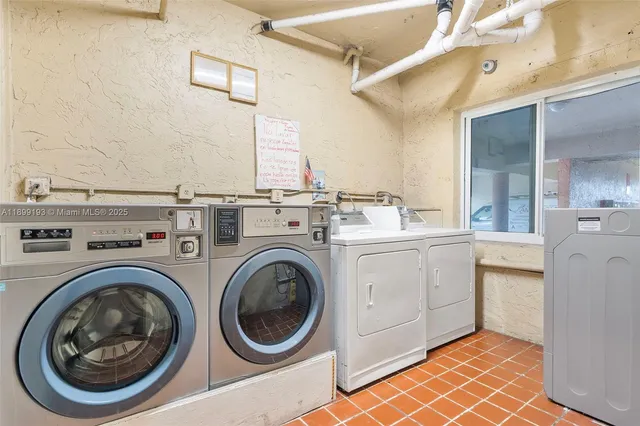 a view of a storage & utility room with washer and dryer