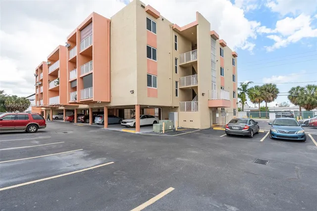 a view of a street with a large building