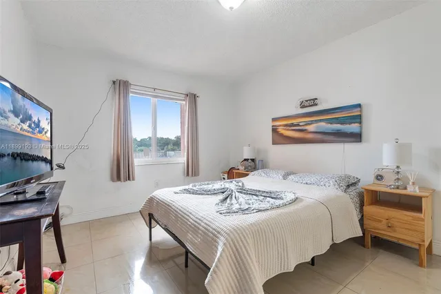 a view of a chair and table in the balcony