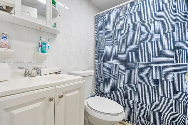 a bedroom with a bed and a cabinets