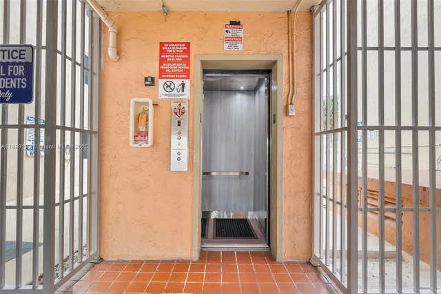 a sign board with an outdoor space