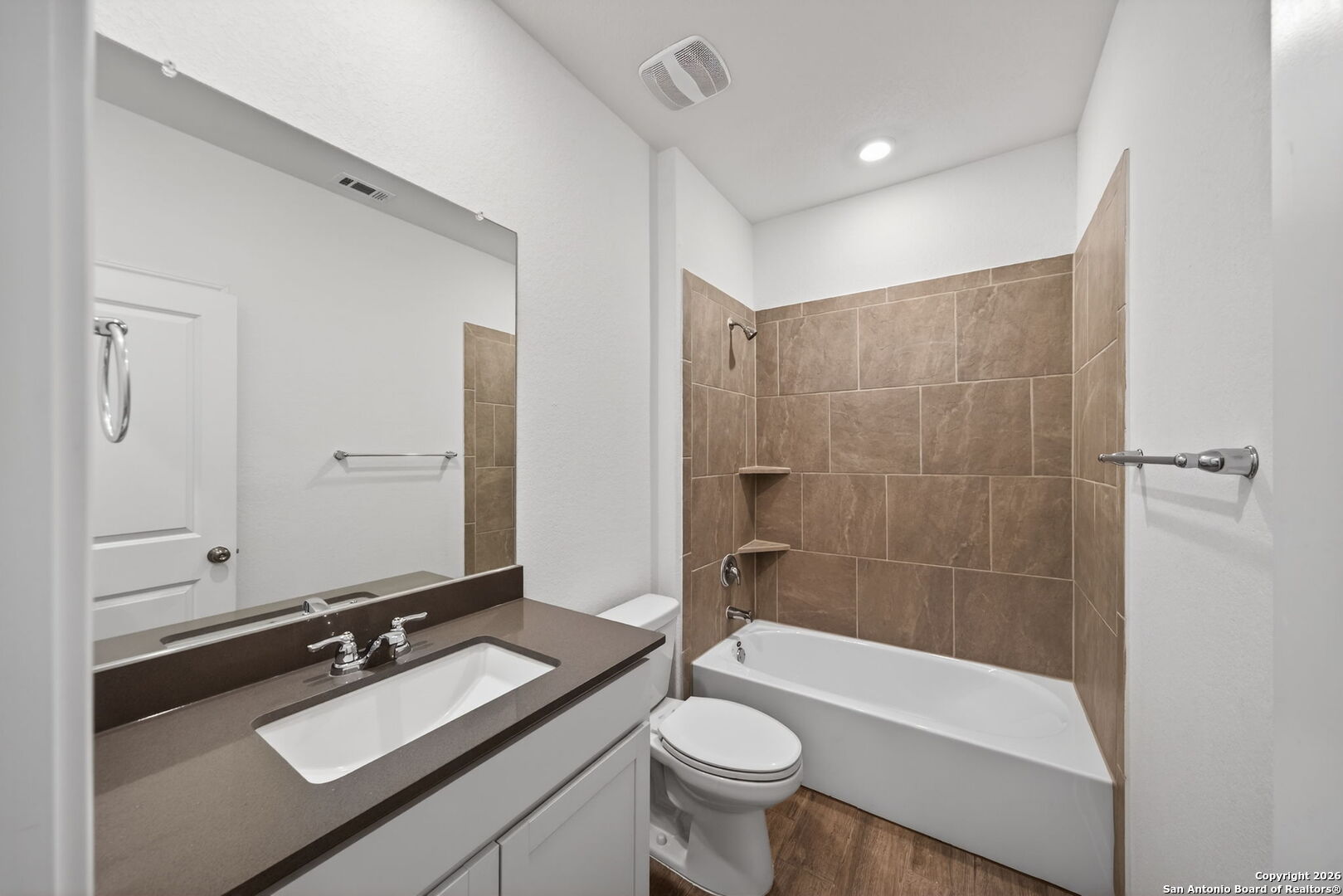5755 Musquiz Ridge Seguin, TX 78155 - Photo 24 of 31 a bathroom with a sink a toilet a mirror and bathtub