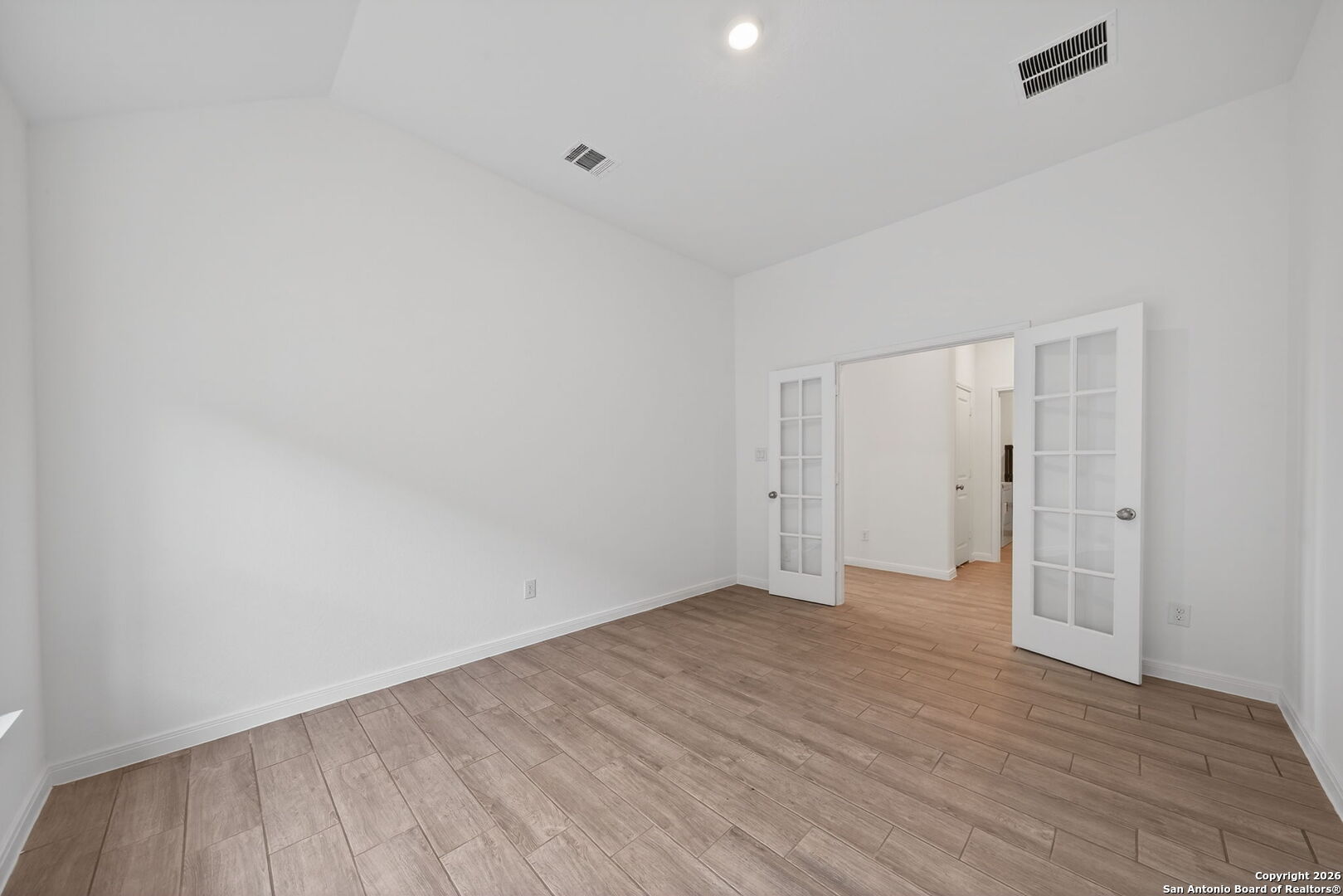 5755 Musquiz Ridge Seguin, TX 78155 - Photo 6 of 31 a view of an empty room with wooden floor