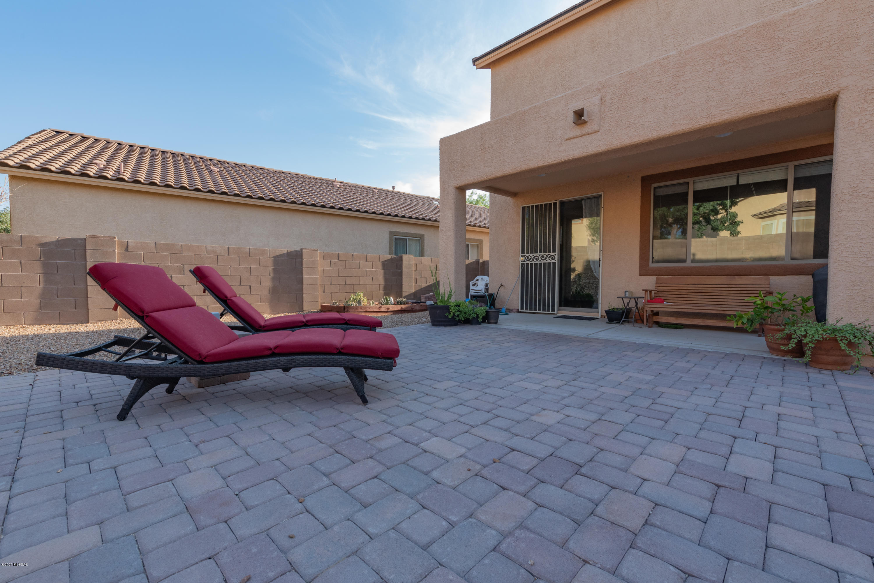 12910 Bloomington Loop Oro Valley, AZ 85755 - Photo 12 of 30 a view of a house with backyard and sitting area