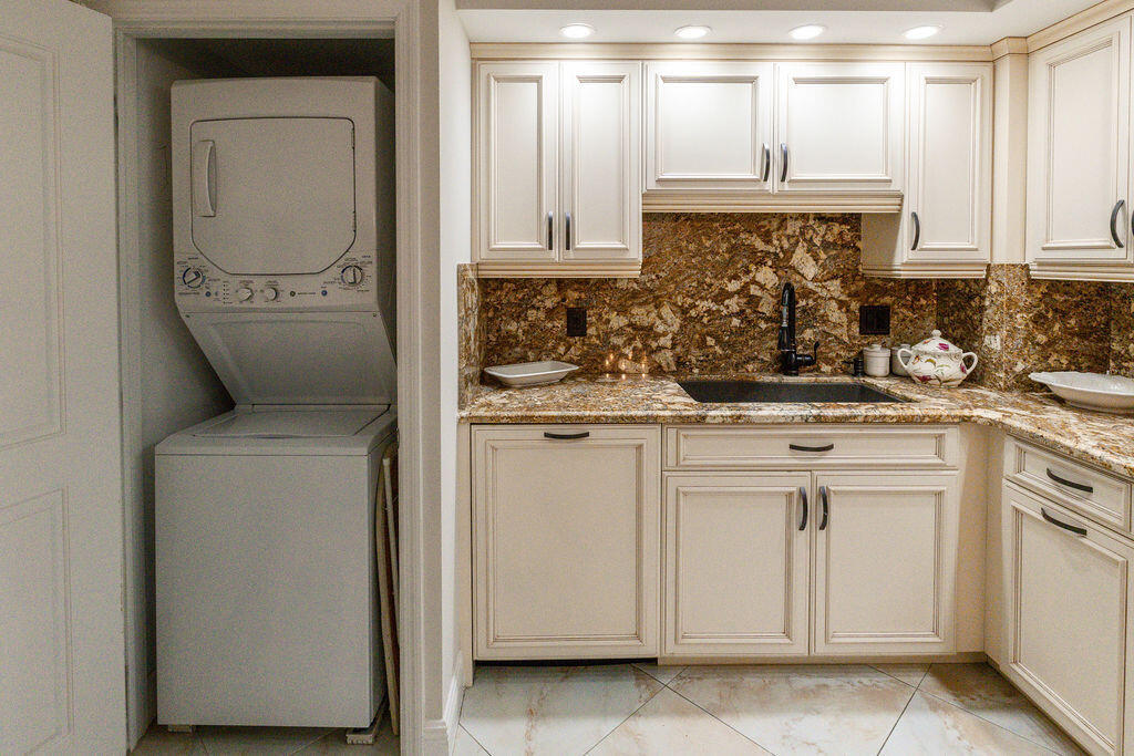 875 East Camino Real Boca Raton, FL 33432 - Photo 8 of 31 a kitchen with a sink and cabinets