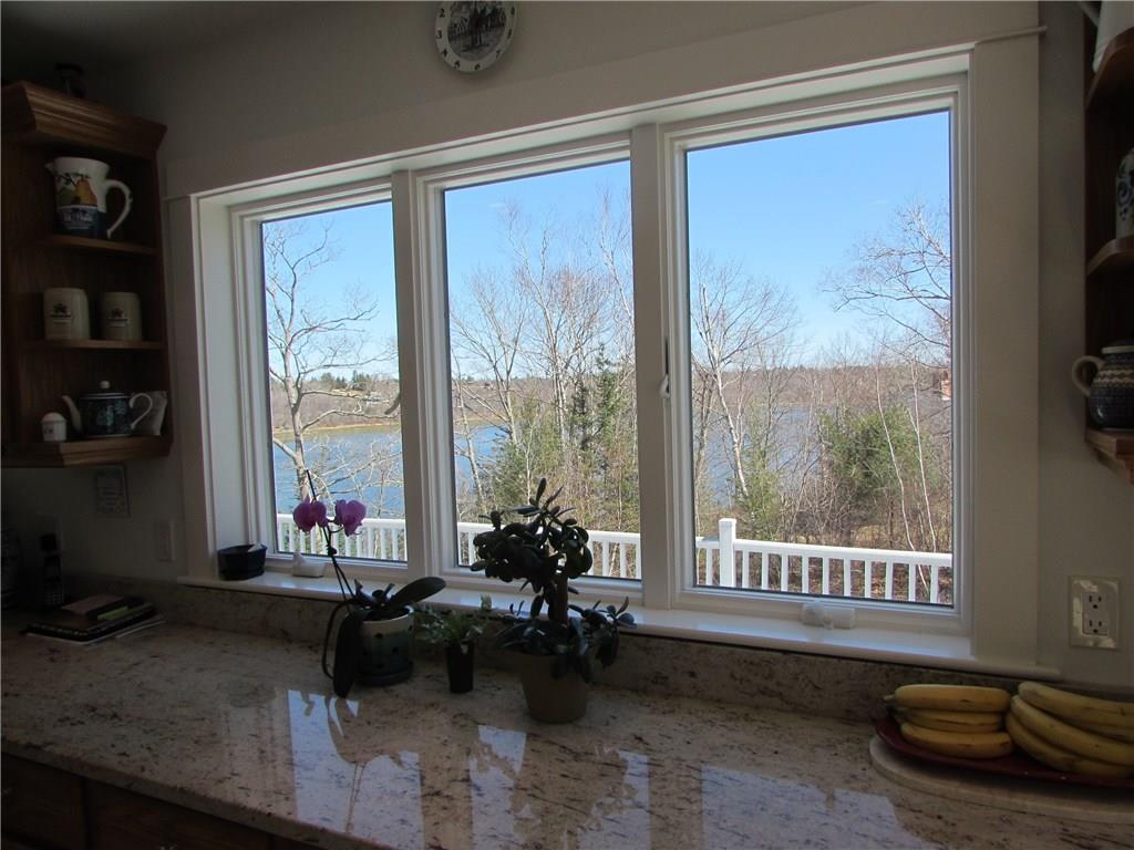 36 Hatch Cove Drive Castine, ME 04421 - Photo 8 of 28 View from kitchen window of deck and...