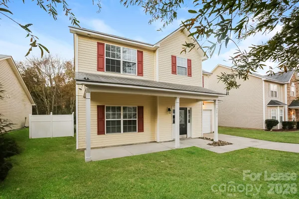front view of a house with a yard