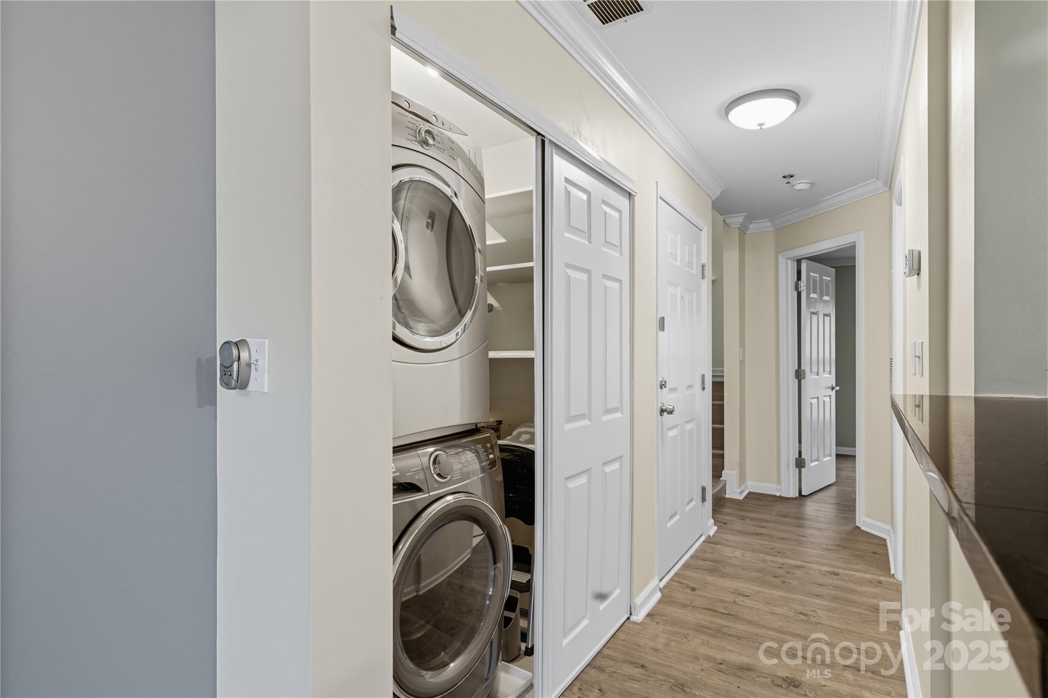 509 North Graham Street, Unit 3J Charlotte, NC 28202 - Photo 11 of 32 a view of a hallway with washer and dryer