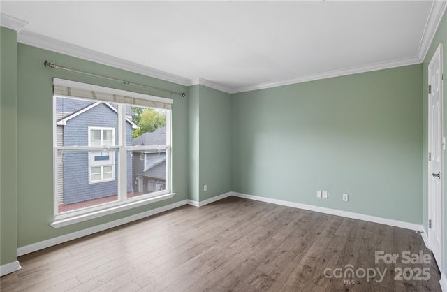 an empty room with windows and outdoor view
