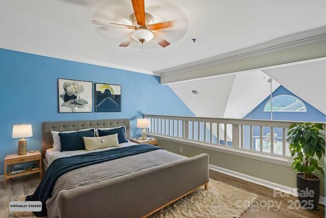 a bedroom with furniture and a chandelier