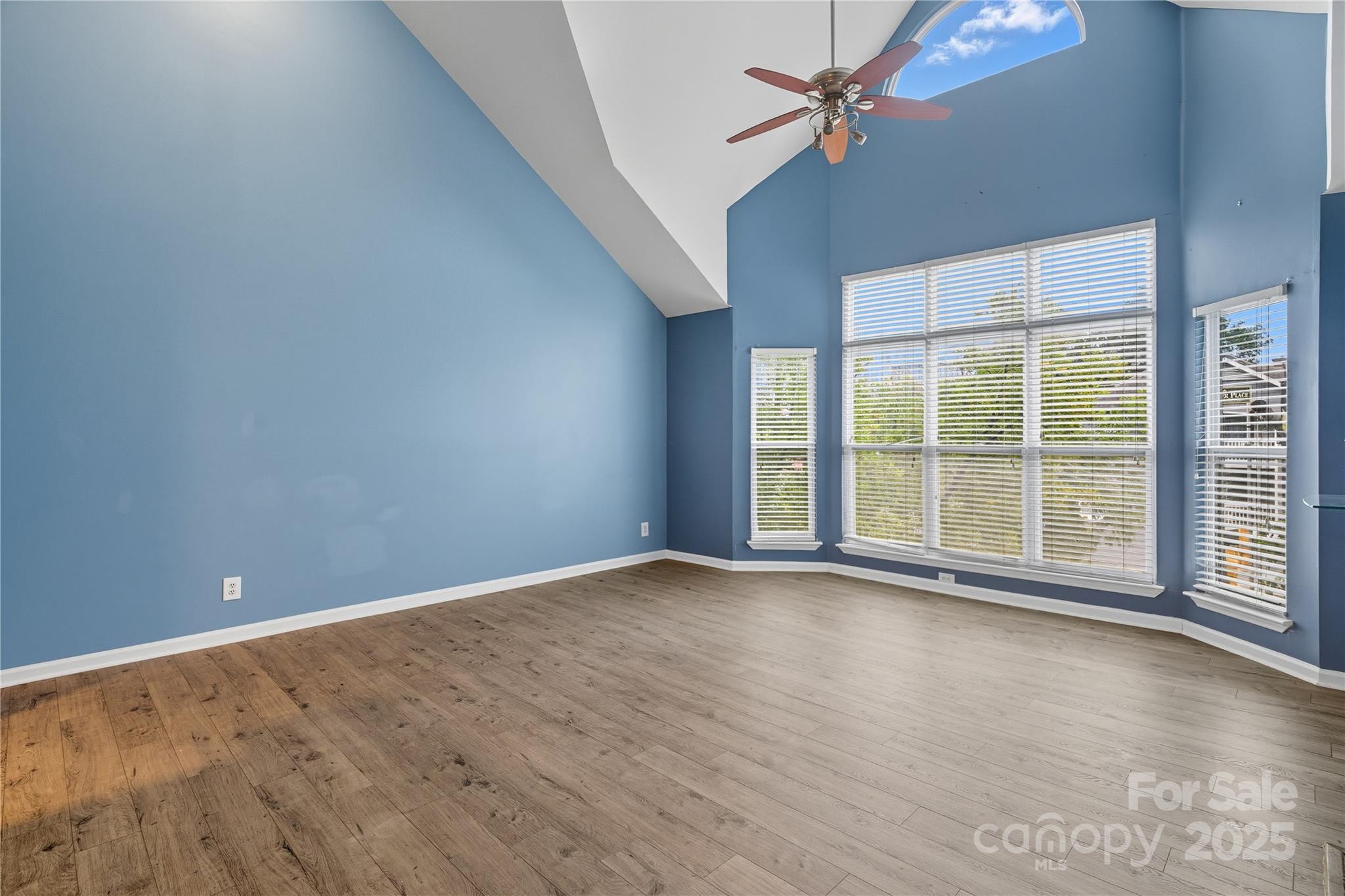 509 North Graham Street, Unit 3J Charlotte, NC 28202 - Photo 2 of 32 wooden floor in an empty room with a window