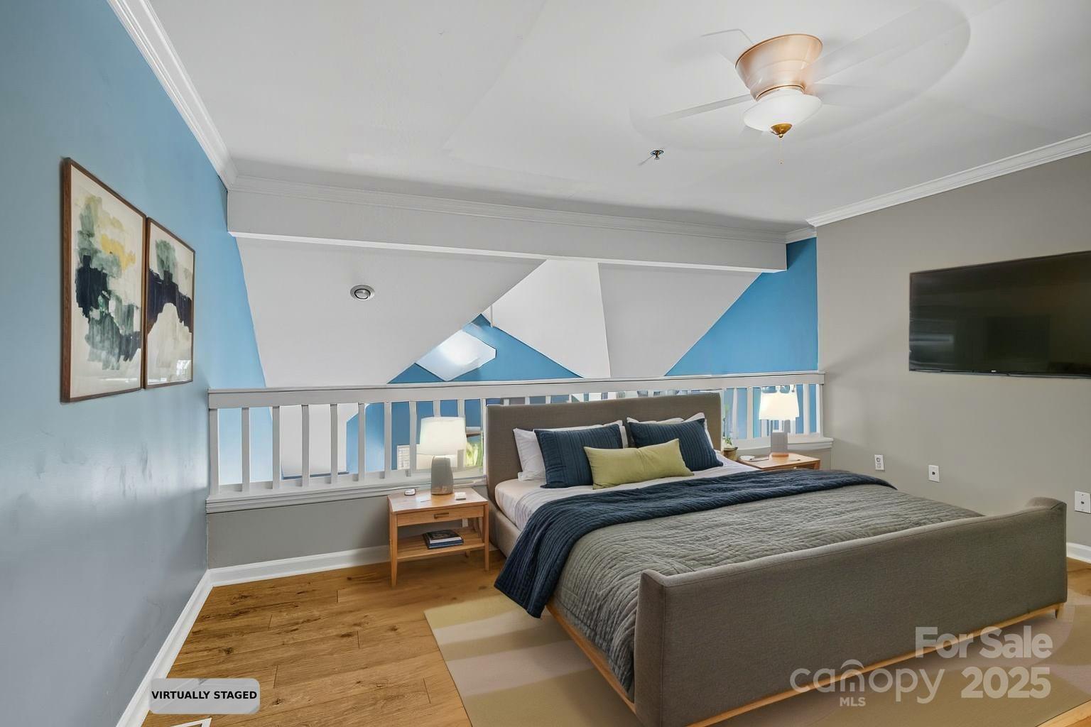 509 North Graham Street, Unit 3J Charlotte, NC 28202 - Photo 22 of 32 a bedroom with a large bed and a flat screen tv