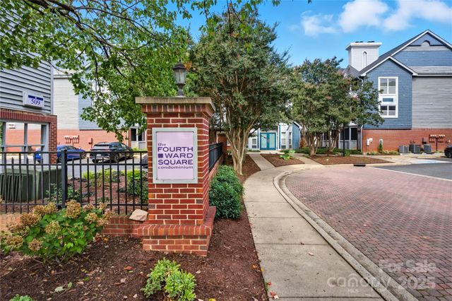 a sign board with yard in front of it